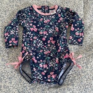 NWOT Ruffle Butts long sleeve swim suit.